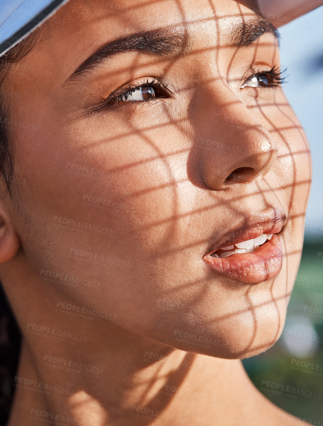 Buy stock photo Shot of an attractive young woman looking contemplative during tennis practice