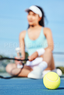 Buy stock photo Full length shot of an unrecognisable woman sitting alone during tennis practice