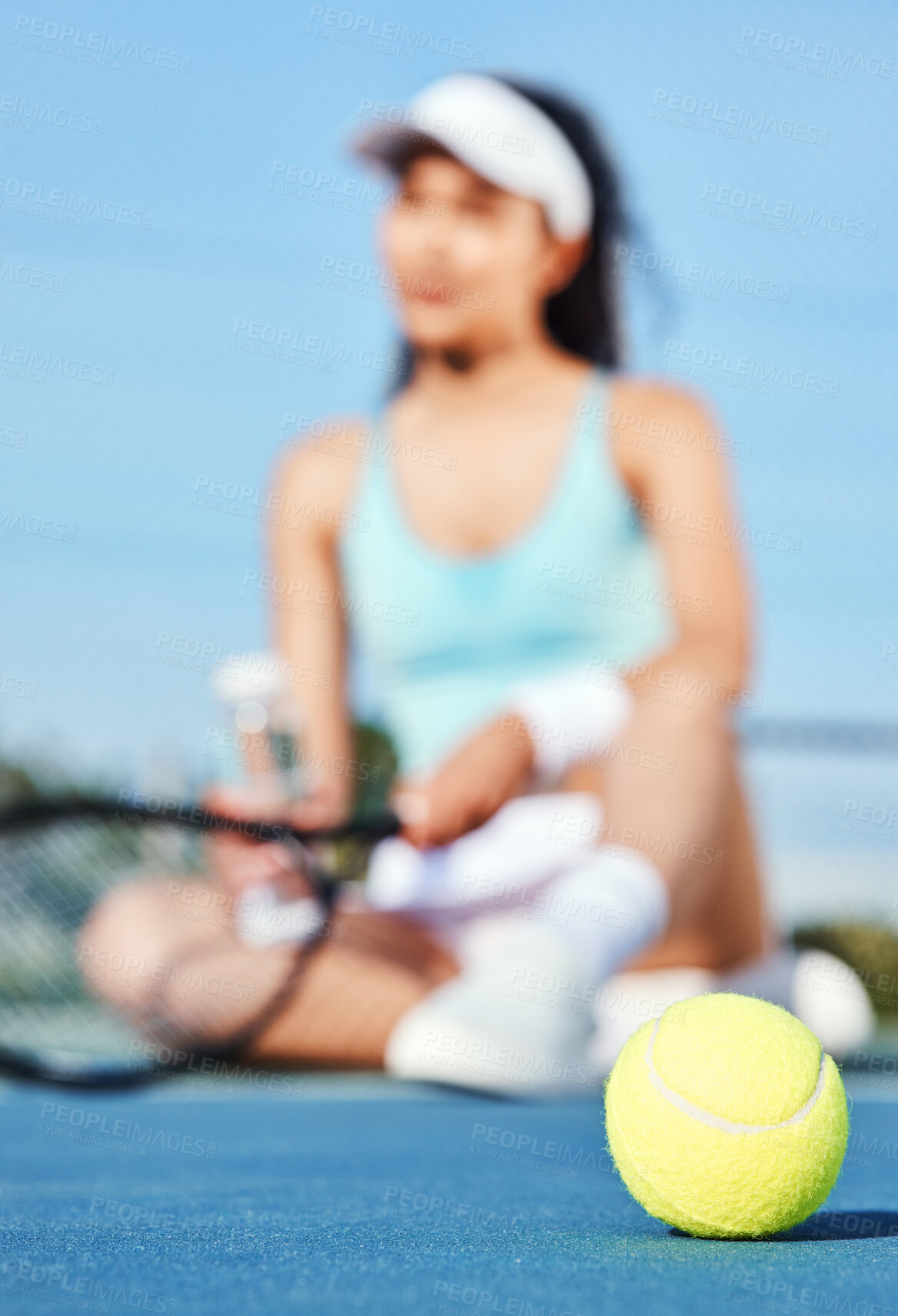 Buy stock photo Full length shot of an unrecognisable woman sitting alone during tennis practice