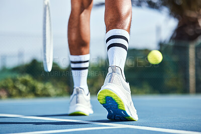 Buy stock photo Cropped shot of an unrecognisable man bouncing a tennis ball during practice