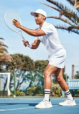 Buy stock photo Full length shot of a handsome young man getting ready to serve the ball during a tennis match