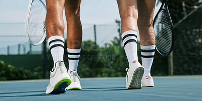 Buy stock photo Shot of two unrecognizable tennis players walking away after a game