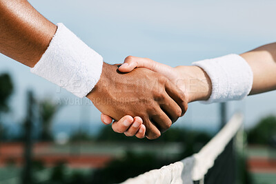 Buy stock photo Shot of two unrecognizable tennis players shaking hands during a tennis match