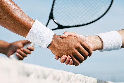 Buy stock photo Shot of two unrecognizable tennis players shaking hands during a tennis match