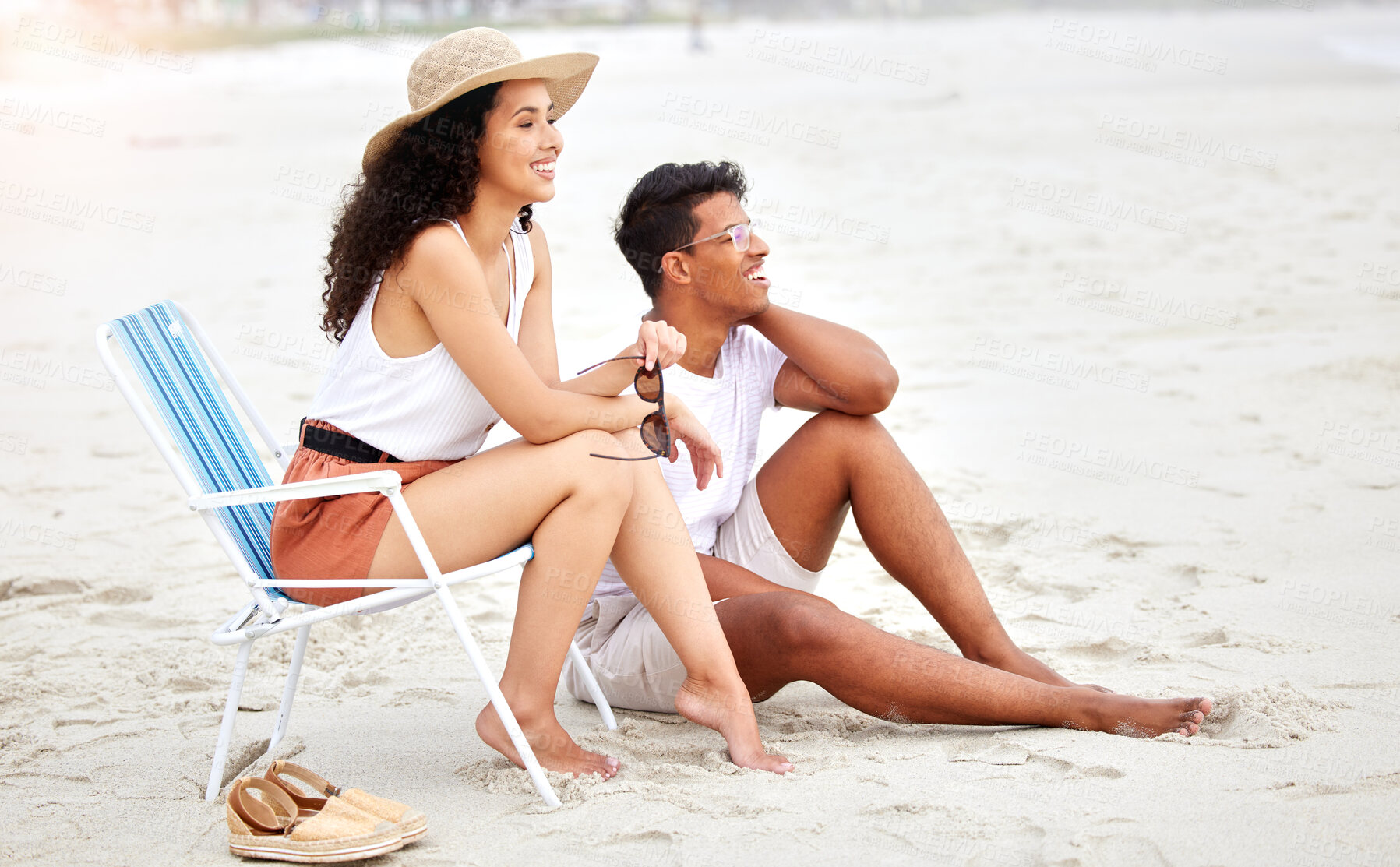 Buy stock photo Happy couple, beach and relax for holiday, vacation and summer together on chair and cool or trendy fashion. Young people or man and woman with smile for travel location by ocean or sea in Mauritius