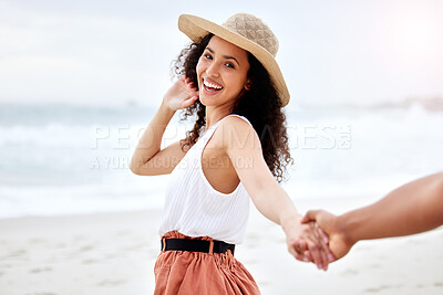 Buy stock photo Shot of a young couple spending a day at the beach