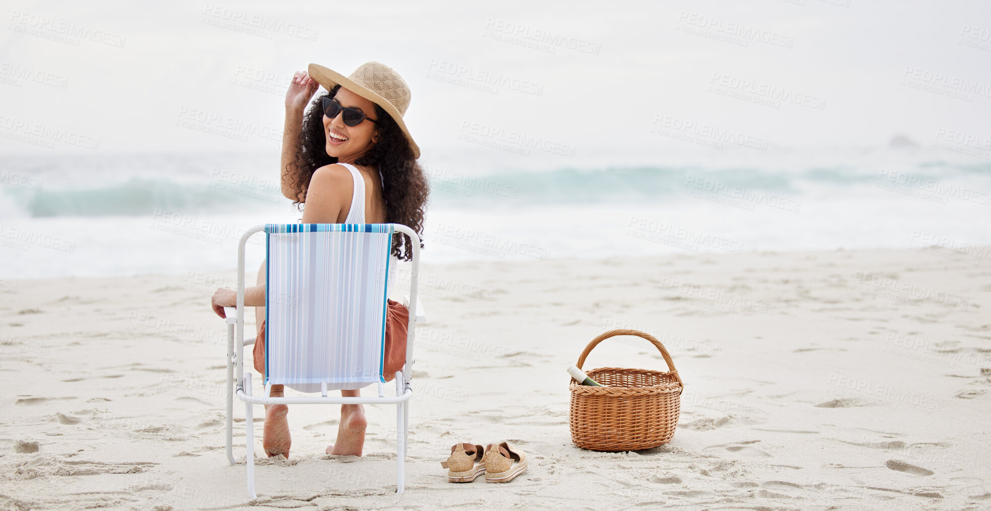 Buy stock photo Happy, picnic and woman on chair at beach to relax on holiday or vacation in summer. Luxury, travel and back of girl with leisure on Cancun island, sand and tropical adventure to ocean or sea mockup