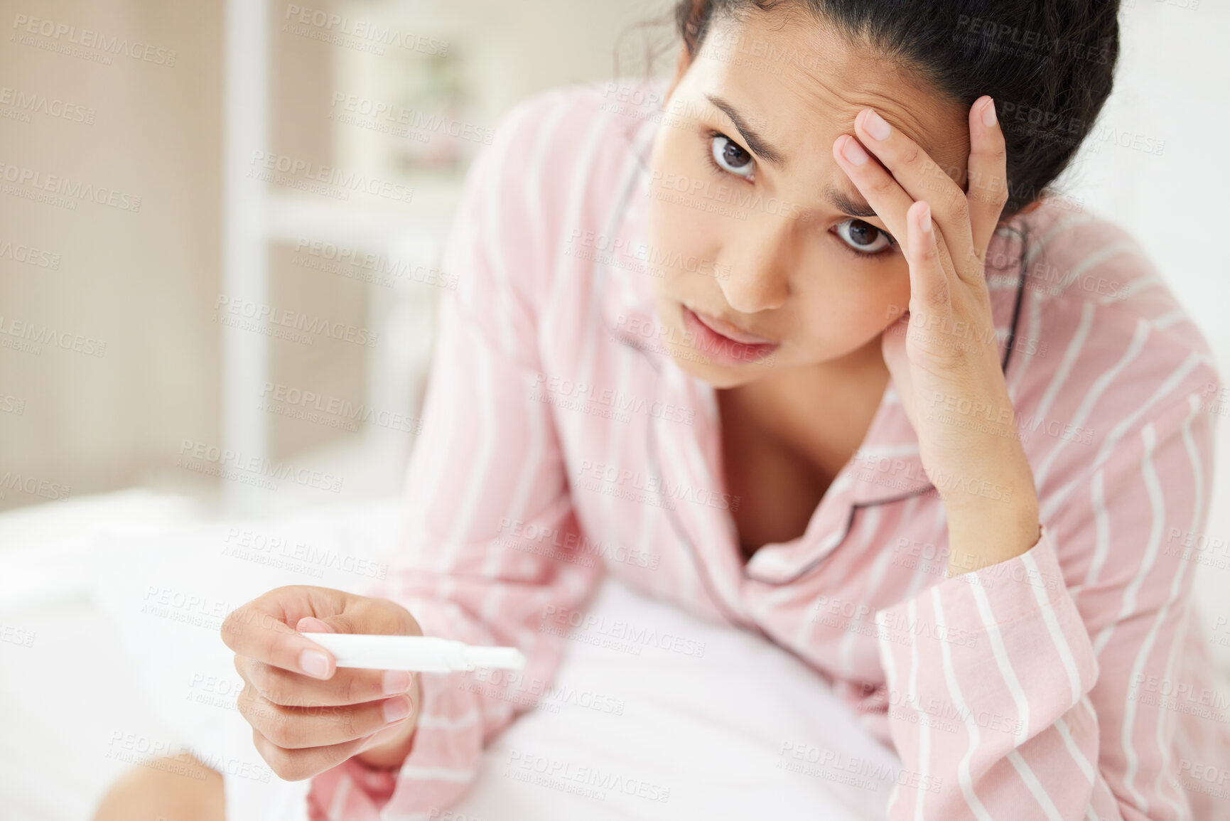 Buy stock photo Woman, portrait and stressed in bedroom for pregnancy test with disappointed, sad emotions and frustrated. Female person, panic and nervous for fear of results, tension and worry for infertility