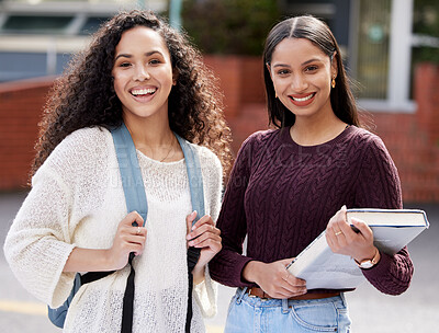 Buy stock photo Shot of two young women studying together at college