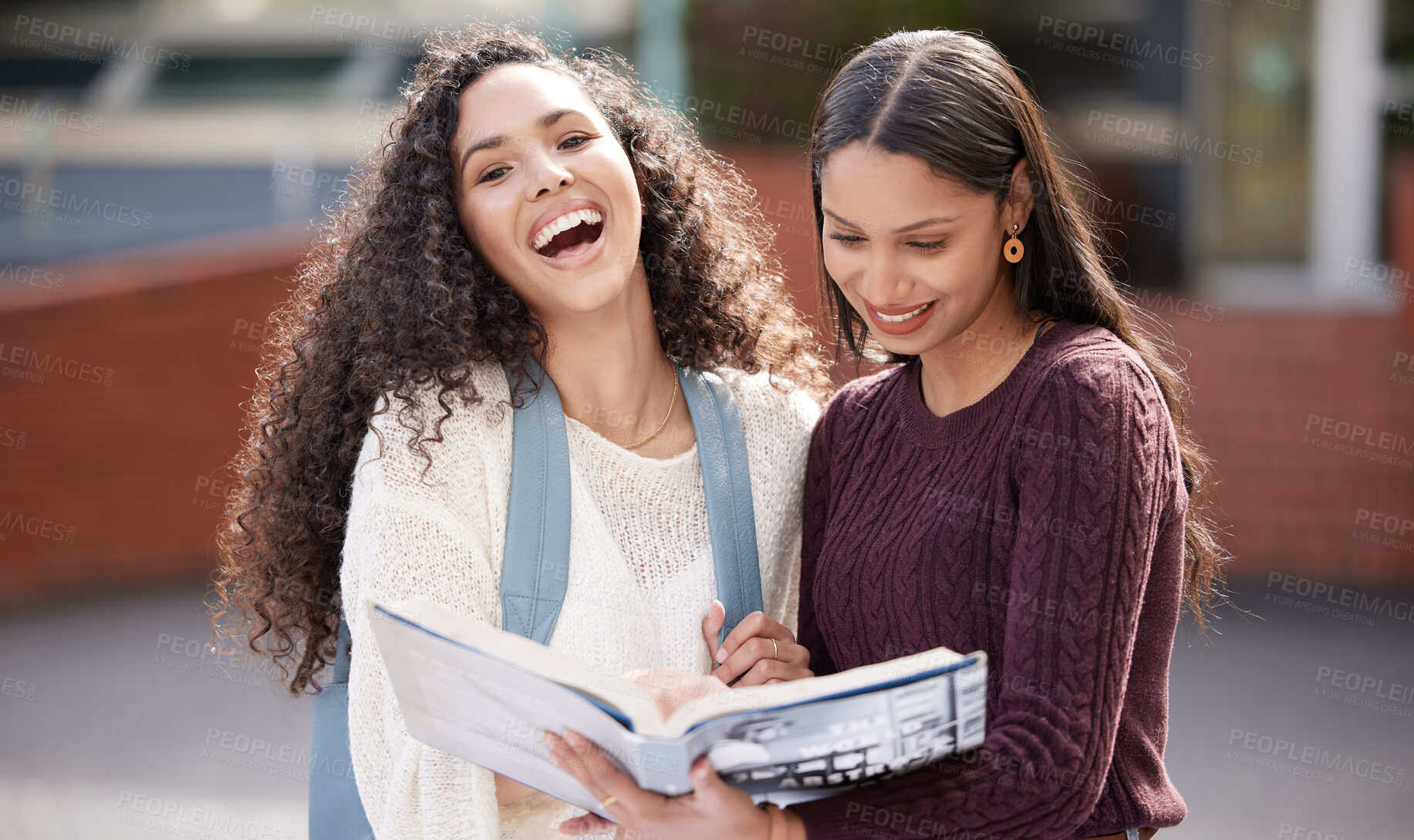 Buy stock photo Laugh, university and portrait of women with book on campus for learning, knowledge and studying. Education, friends and happy female students laugh with textbook for information, research or college