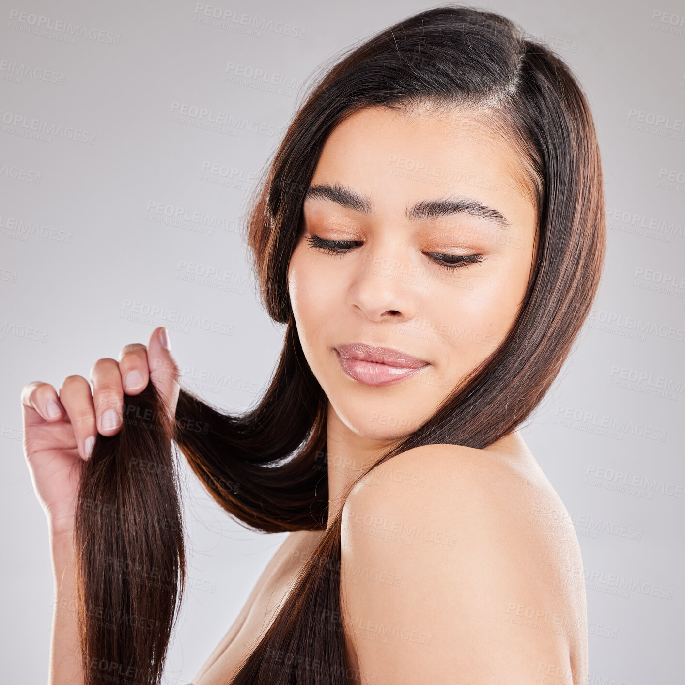 Buy stock photo Haircare, shine and woman on studio backdrop with hair in hand, strong with texture and salon treatment. Model, mockup and beauty, healthy straight hairstyle with keratin product on grey background.