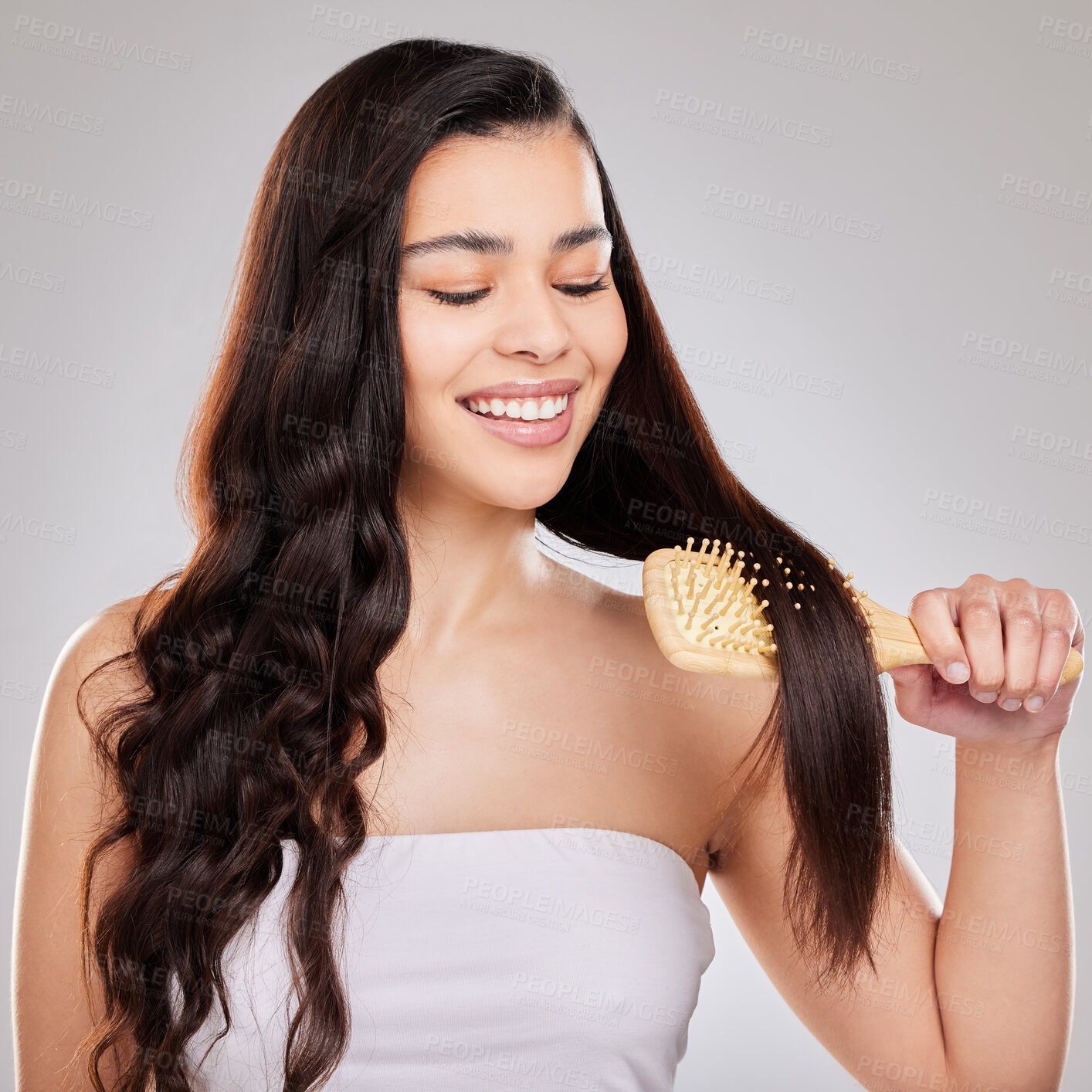 Buy stock photo Haircare, shine and brush in studio, woman and smile with treatment from salon, happy and texture. White background, growth and glow of hair, hairstyle and person with product for hairdresser