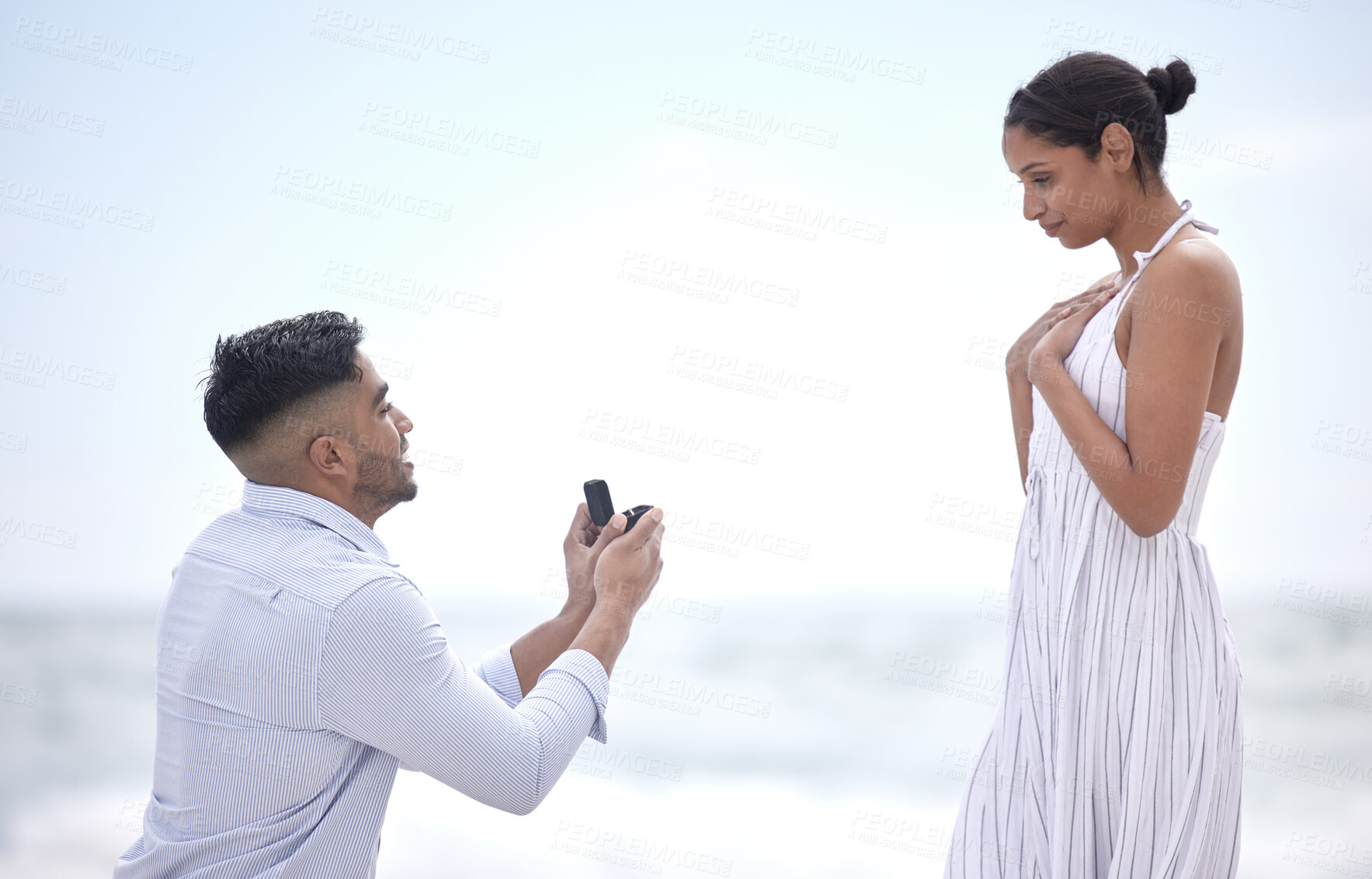 Buy stock photo Beach, proposal and couple with love, question and happiness with relationship, vacation and adventure. Surprise, seaside and man with woman, ring and engaged with romance, commitment and support