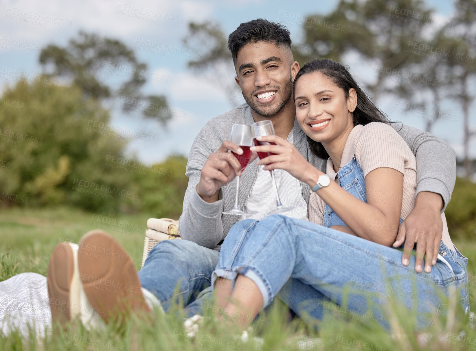 Buy stock photo Man, woman and portrait with cheers in nature for date, picnic and champagne for relax in field. Couple, happiness and toast for love in park for celebration, anniversary and countryside for vacation