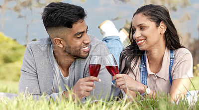 Buy stock photo Cheers, man and woman with love in nature for date, picnic and champagne for relax in field. Couple, people and toast for romantic celebration, anniversary and vacation or travel to countryside 