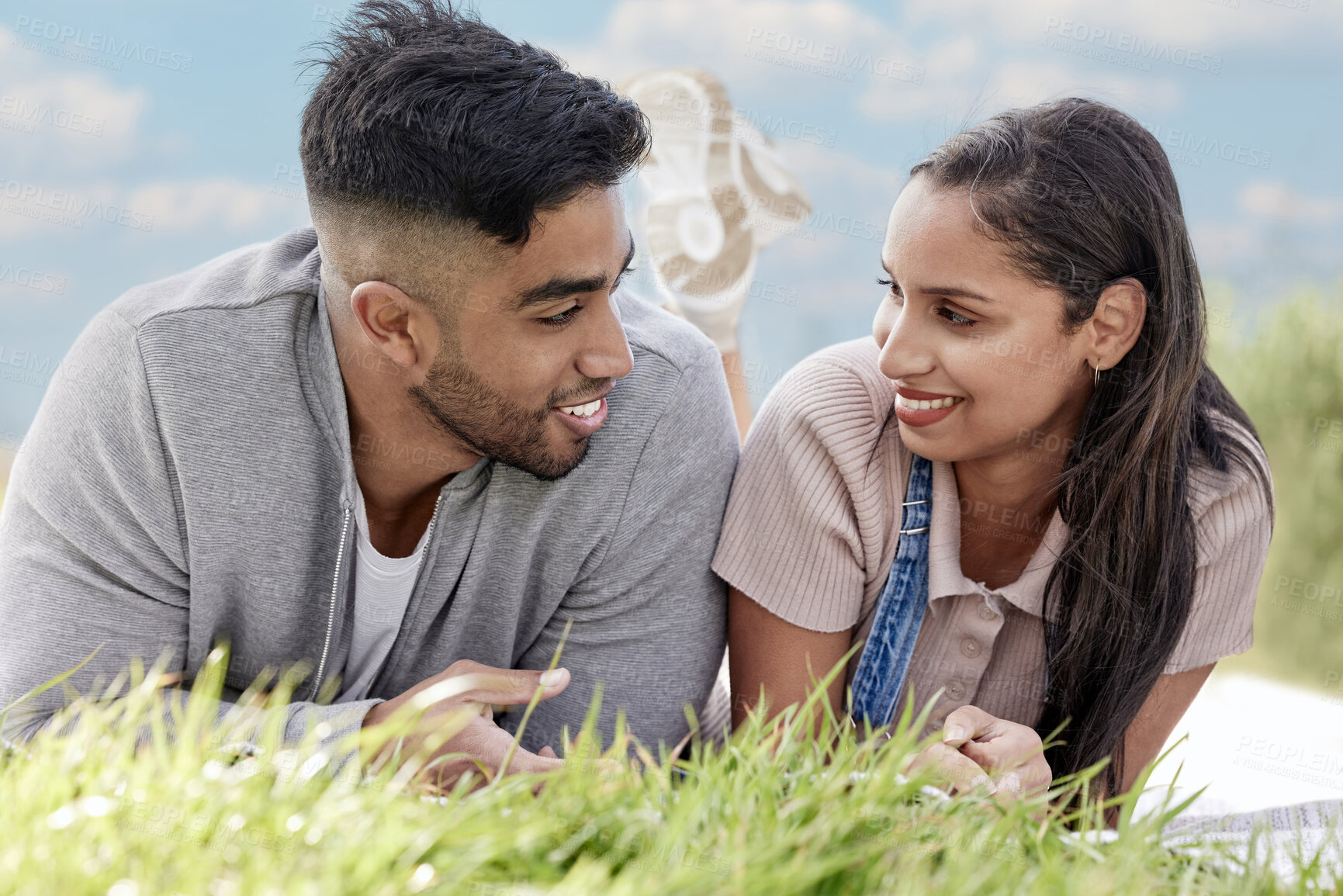 Buy stock photo Happy, couple and picnic in park for romantic date, love or celebration and relaxing together on grass. People, man and woman smile in nature for bonding, relationship and calm day outdoor on weekend