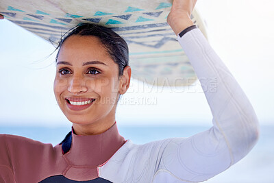 Buy stock photo Girl, surfer and board on head at beach, workout and training for water sports competition. Female person, health and travel to ocean or sea for waves, fitness and athlete for exercise in nature