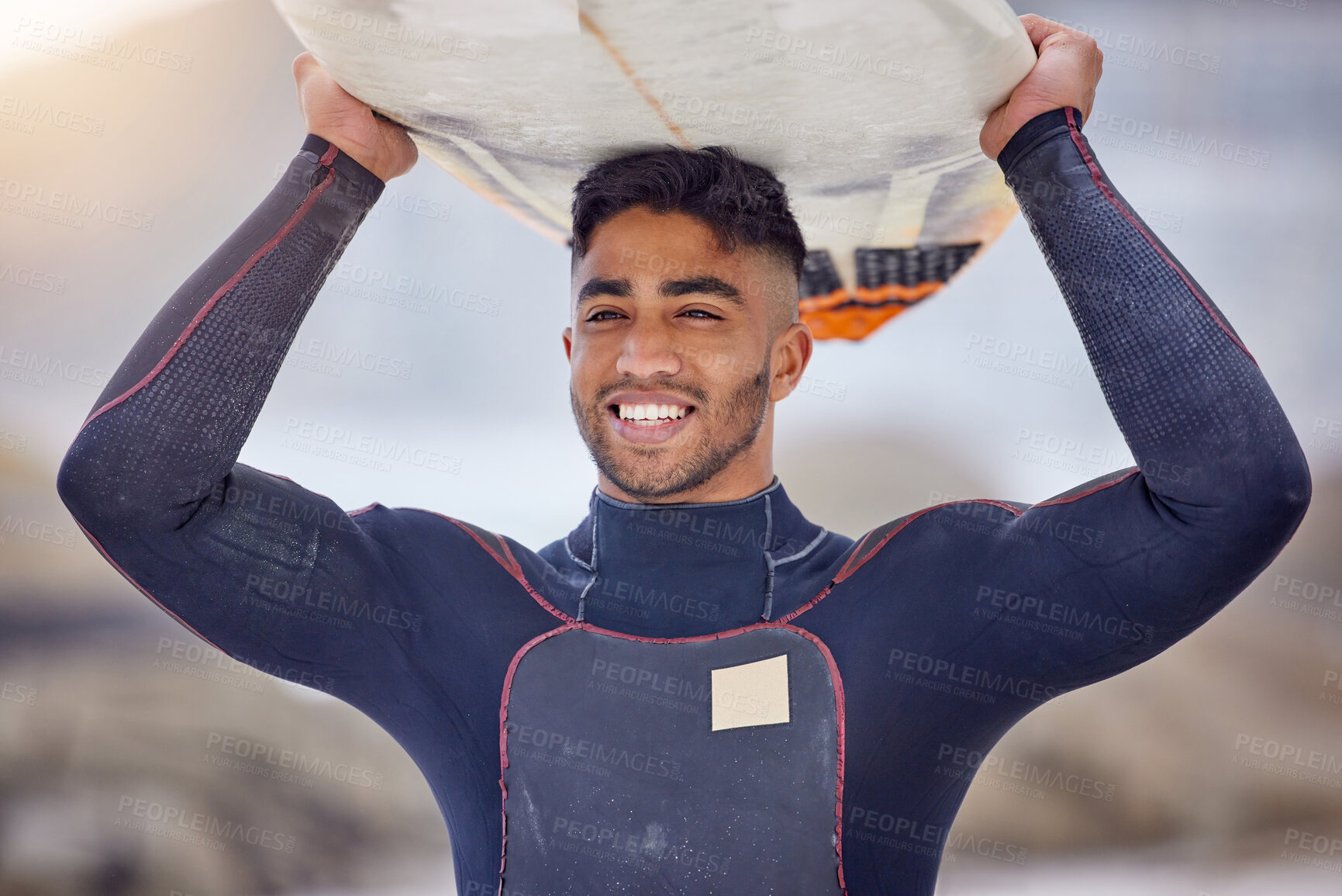 Buy stock photo Man, surfing and board on head at beach, workout and training for water sports competition. Male person, health and travel for hobby on weekend, fitness and athlete for exercise in outdoor nature