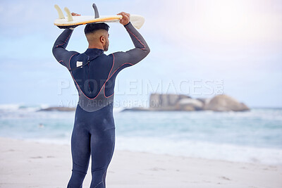 Buy stock photo Man, surfer and board on head on shore, workout and training for water sports competition. Male person, back and travel to ocean or sea for waves, fitness and athlete for exercise in outdoor nature