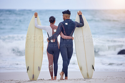 Buy stock photo Hug, surfboard and couple on beach with waves for watersports, tropical holiday or travel adventure together. Embrace, man and woman at ocean for surfing, Hawaii island vacation and bonding from back