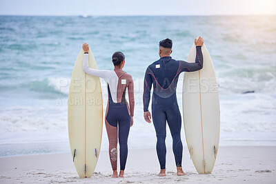 Buy stock photo Waves, surfboard and couple on beach with watersports, tropical holiday fun or travel adventure together. Love, man and woman at ocean for surfing, island vacation and bonding from back in Hawaii.