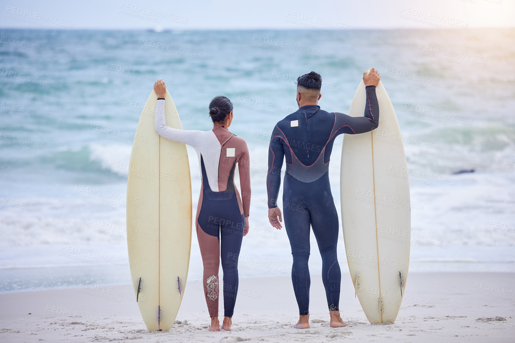 Buy stock photo Waves, surfboard and couple on beach with watersports, tropical holiday fun or travel adventure together. Love, man and woman at ocean for surfing, island vacation and bonding from back in Hawaii.