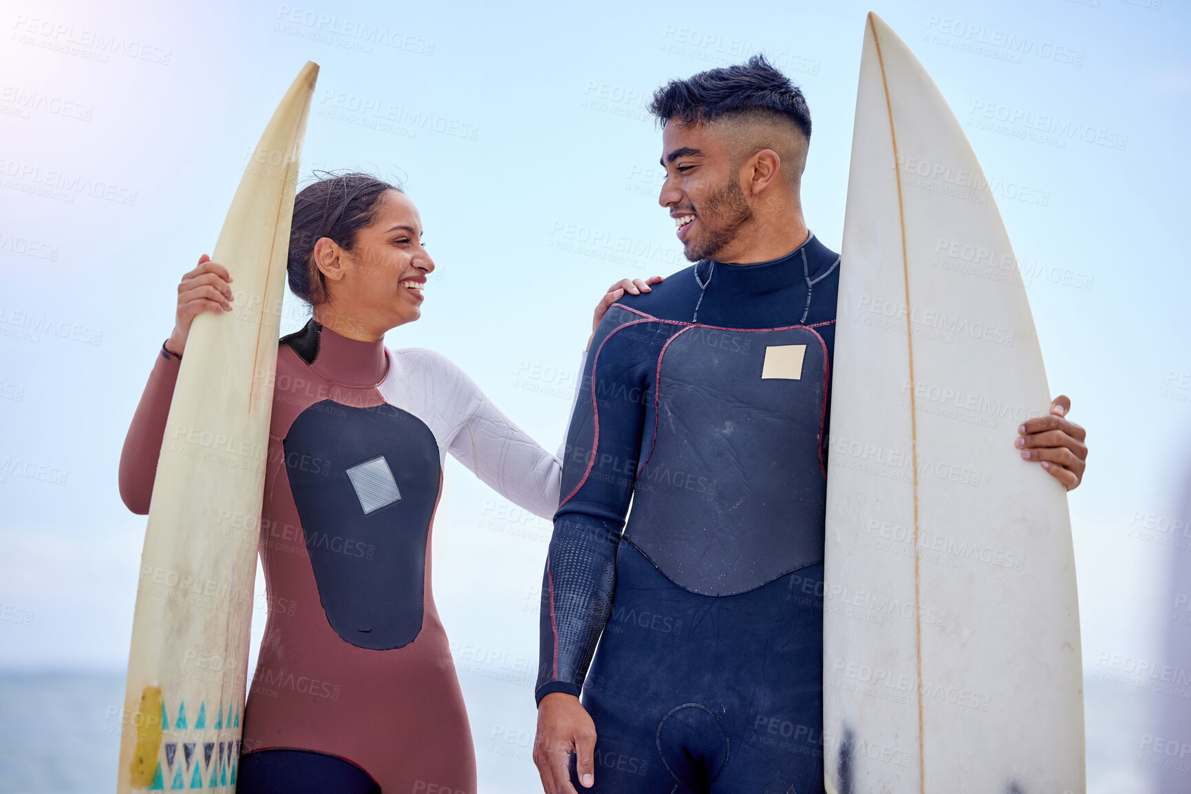 Buy stock photo Nature, surfboard and couple on beach talking for water sports, tropical holiday and travel adventure together. Support, man and woman at ocean for surfing, island vacation and bonding in Hawaii.