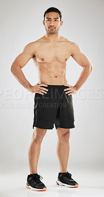 Buy stock photo Fitness, portrait or man topless in studio with abs, muscle development or confident for progress. Male athlete, arm strength or serious on gray background for goal, healthy body or personal trainer