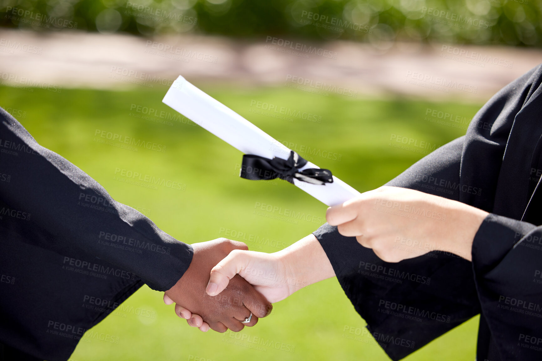 Buy stock photo University, handshake and hands of people at graduation with degree for success, achievement and education. College campus, school and students with certification, award and scroll for ceremony