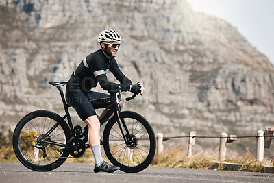 Buy stock photo Full length shot of a handsome mature man taking a break while cycling outdoors