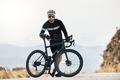 Buy stock photo Full length shot of a handsome mature man taking a break while cycling outdoors