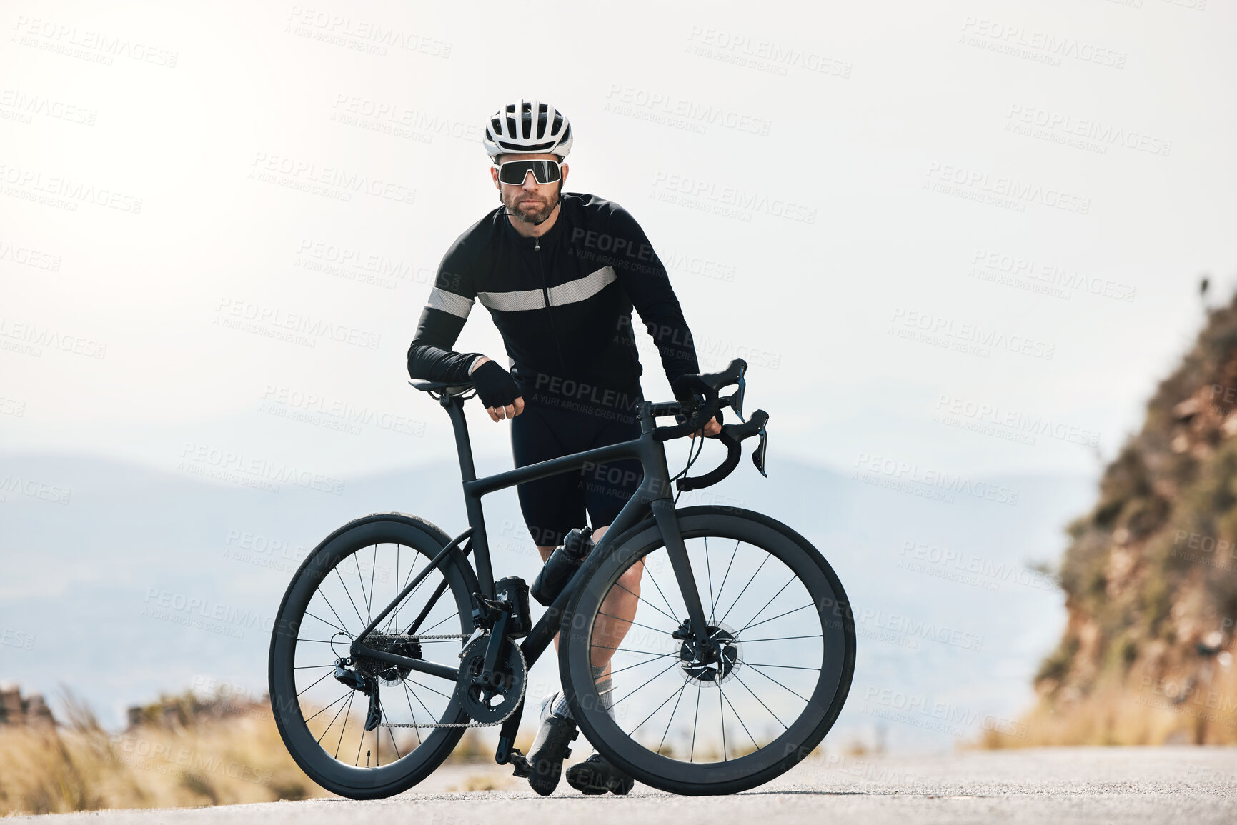 Buy stock photo Full length shot of a handsome mature man taking a break while cycling outdoors