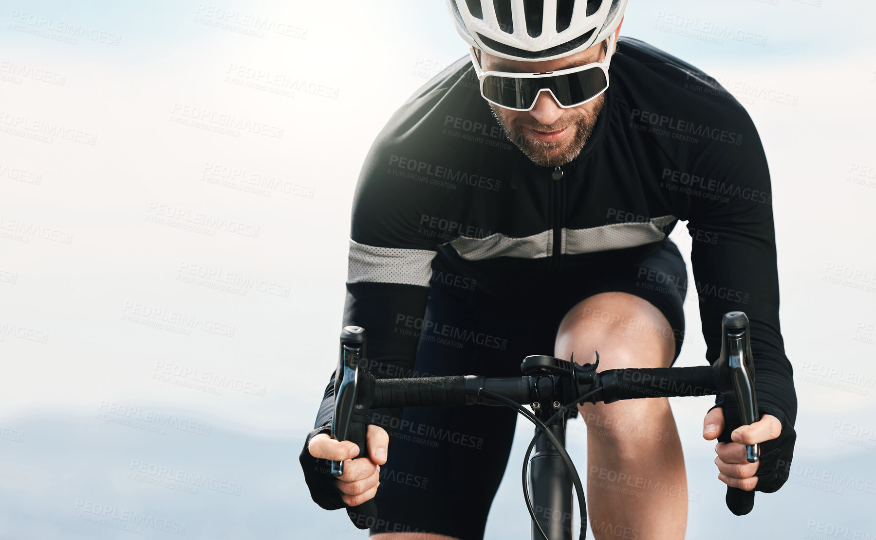 Buy stock photo Cropped shot of a handsome mature man cycling outdoors