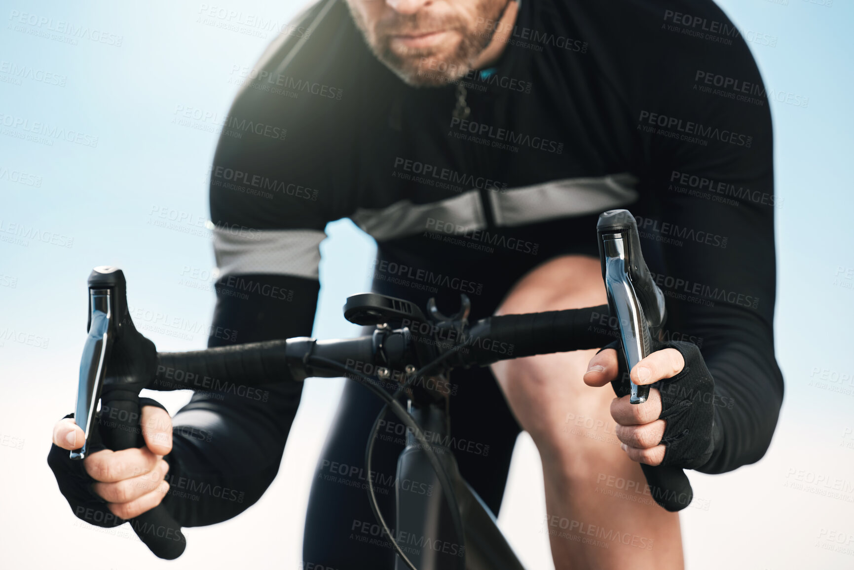 Buy stock photo Cropped shot of an unrecognizable man cycling outdoors