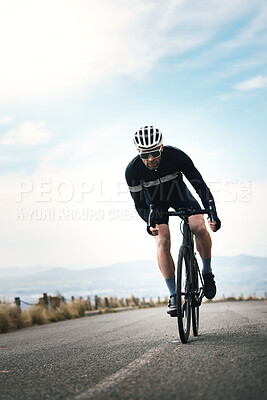 Buy stock photo Full length shot of a handsome mature man cycling outdoors