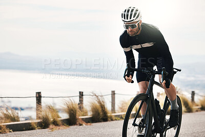 Buy stock photo Cropped shot of a handsome mature man cycling outdoors