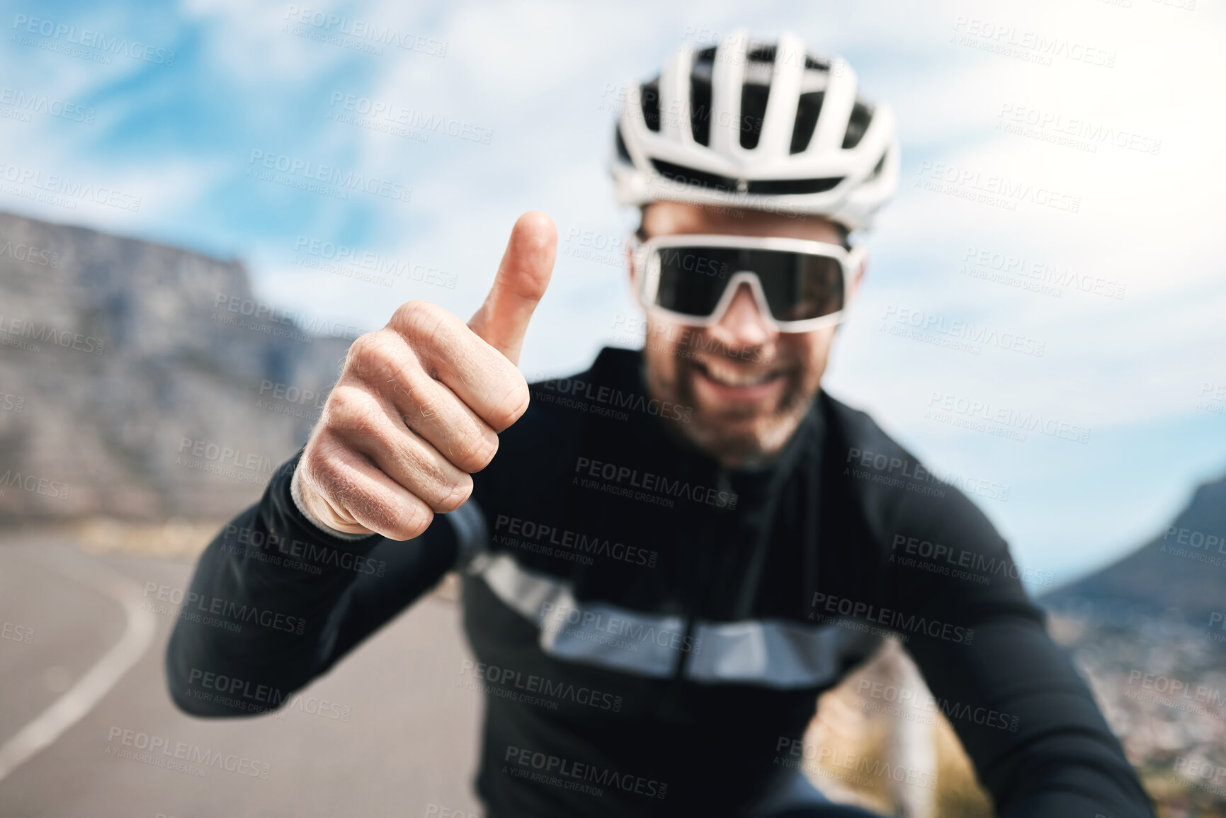 Buy stock photo Cropped shot of a handsome mature man gesturing thumbs up while cycling outdoors