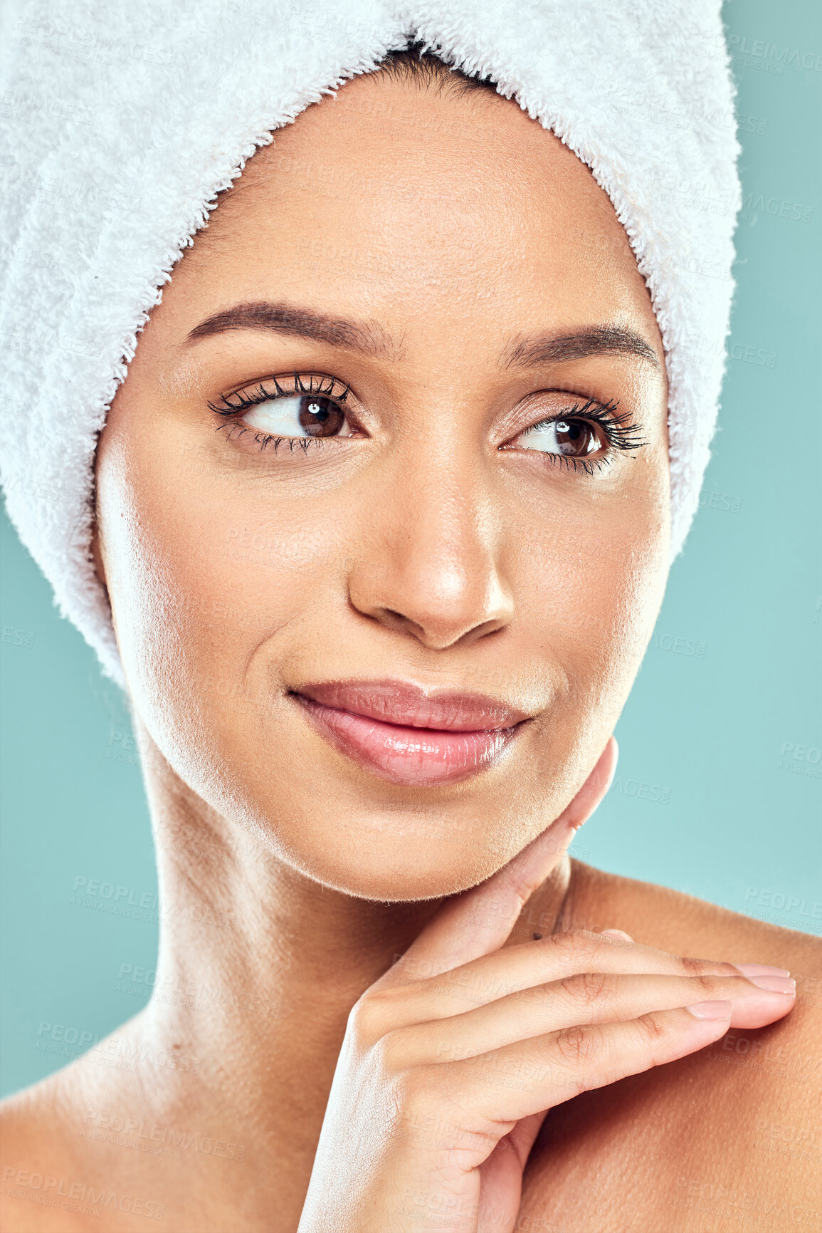 Buy stock photo Woman, thinking and pride with towel in studio for shower, hygiene and smile for cleaning. Model girl, confidence and idea for wellness or glow in morning with routine and skincare by blue background