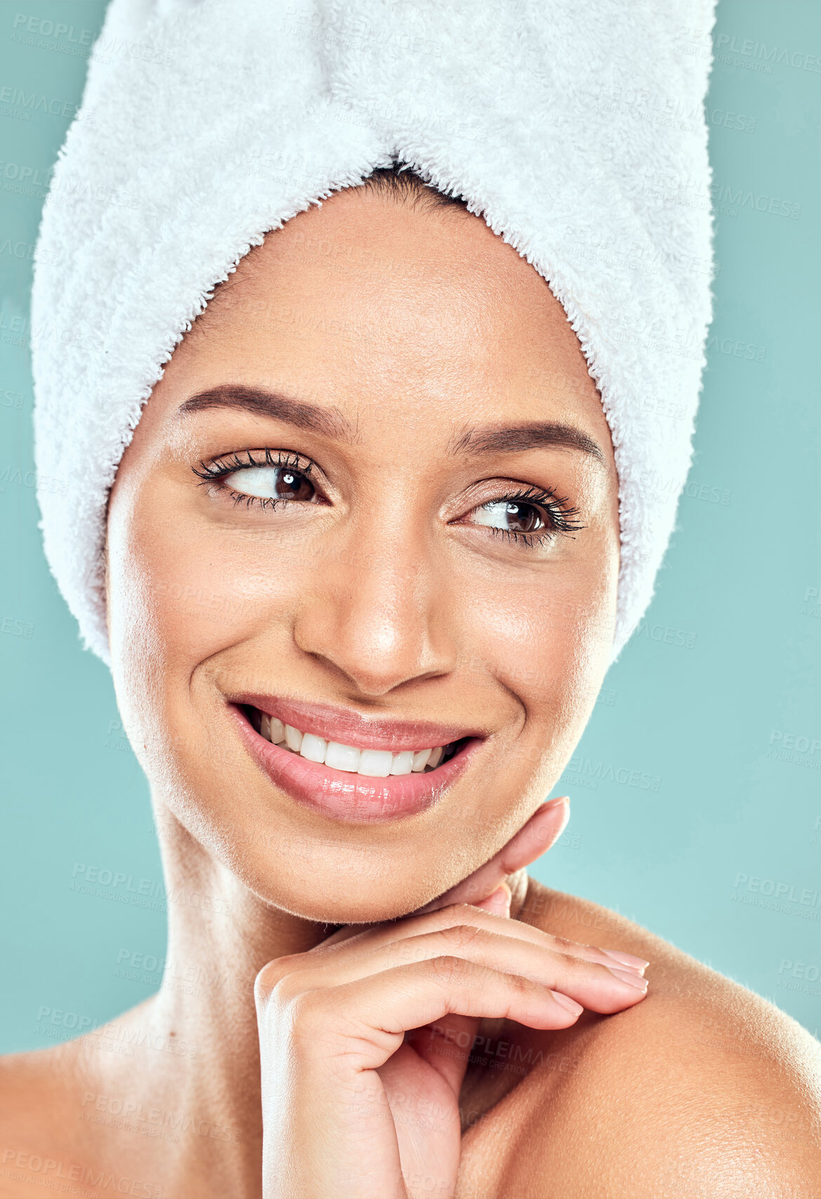 Buy stock photo Happy woman, thinking and towel with hand in studio for shower, hygiene and smile for cleaning. Model girl, pride and idea for wellness, grooming and glow with routine and skincare by blue background