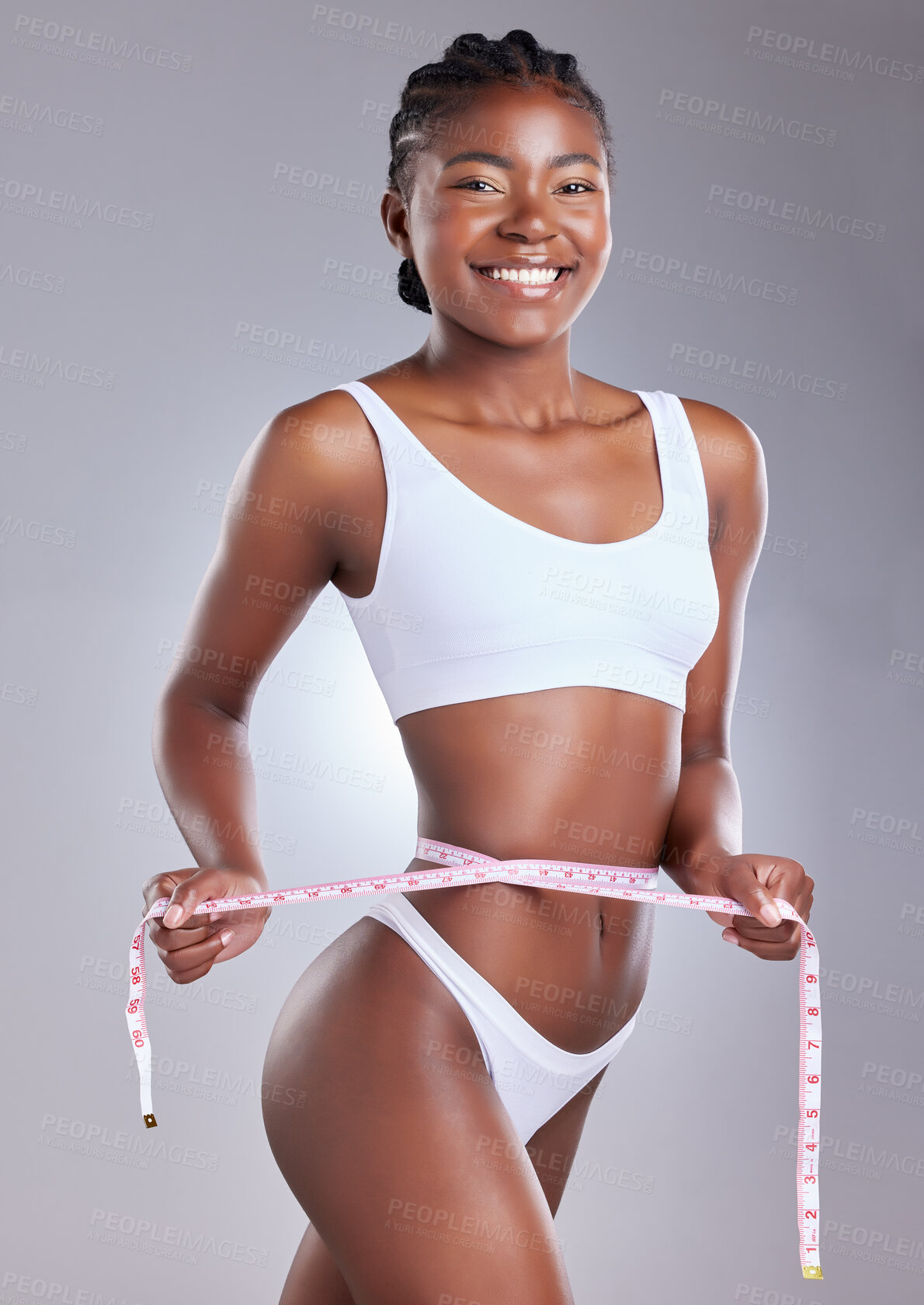 Buy stock photo Black woman, studio and underwear with measure tape for waist, smile in portrait for weight loss. Female person, gray background and bikini for healthy diet with results, transformation with exercise