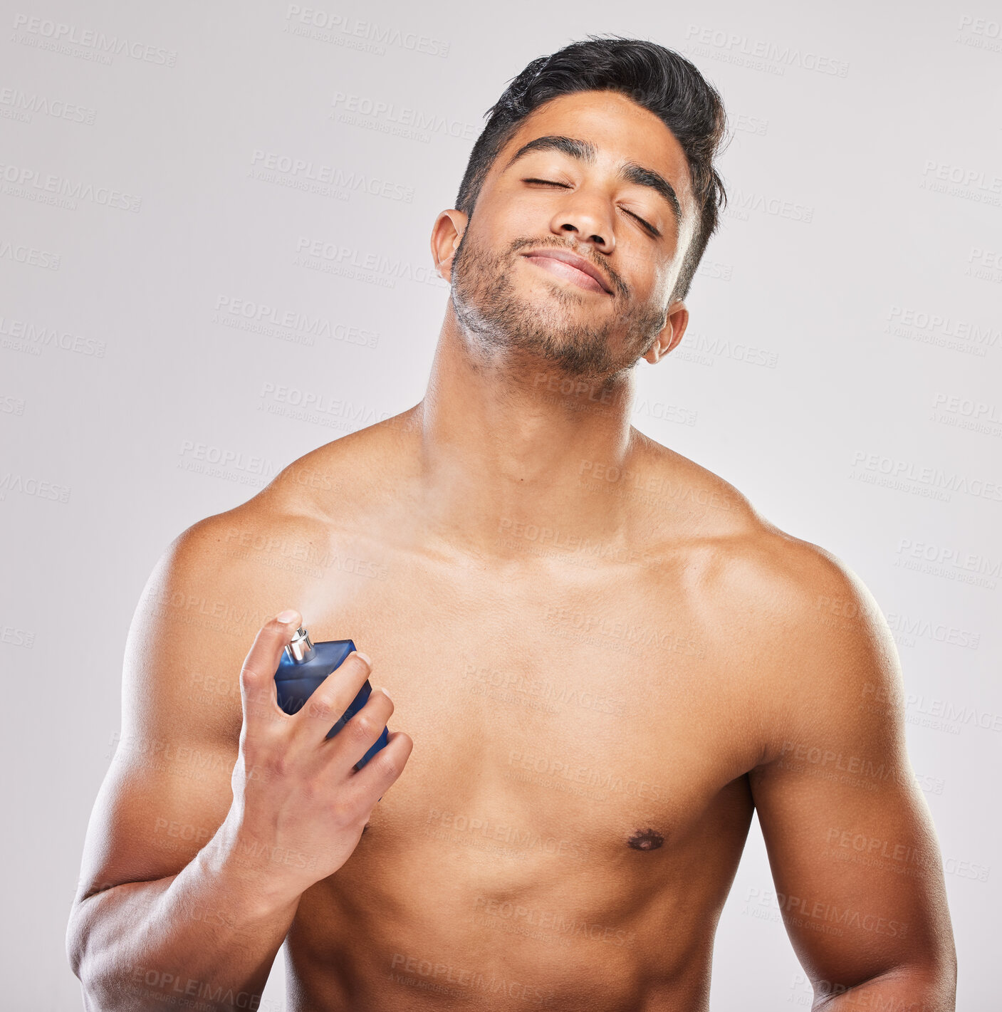 Buy stock photo Happy, man and skincare with hands for deodorant spray for fresh scent, hygiene and grooming routine isolated in studio. Male person, shirtless and cologne or perfume for wellness on white background