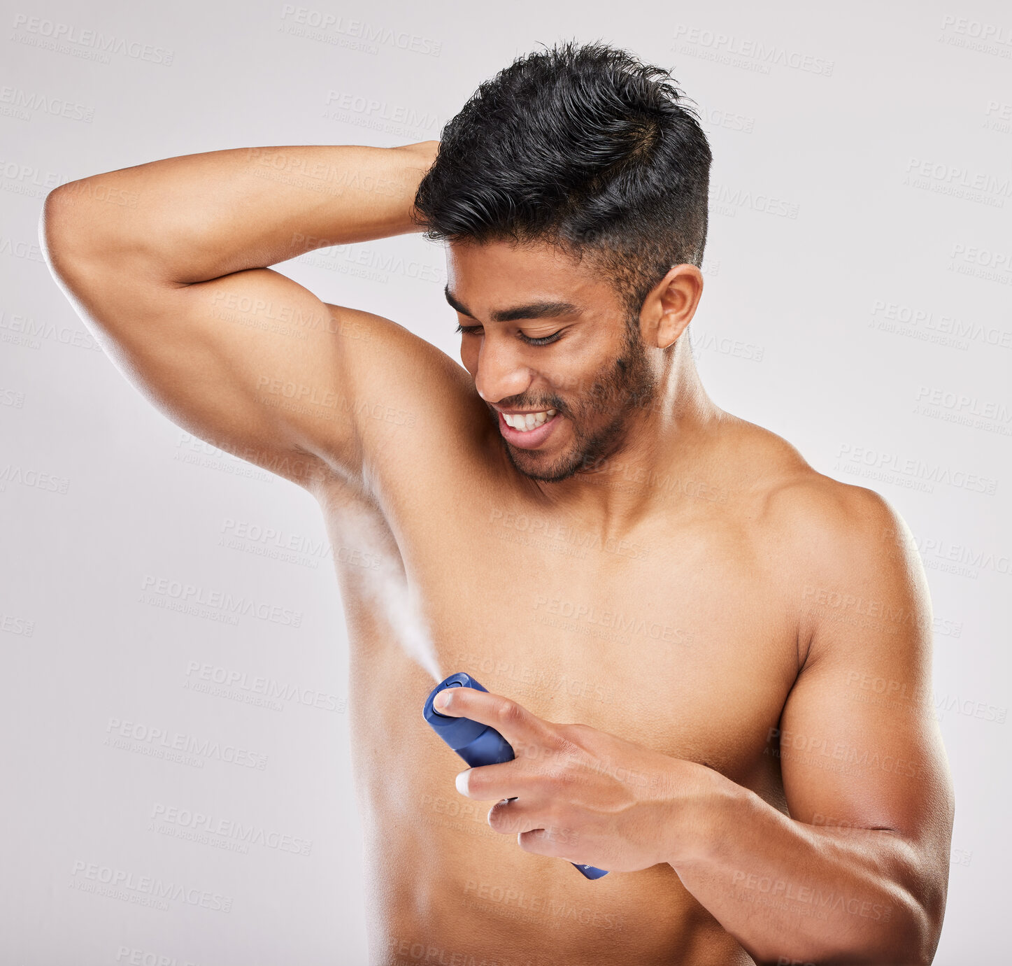 Buy stock photo Grooming, man and deodorant in morning, routine and wellness in body care, hygiene and grey background. Male person, cosmetics and fresh for confidence, masculine and fragrance with product in studio