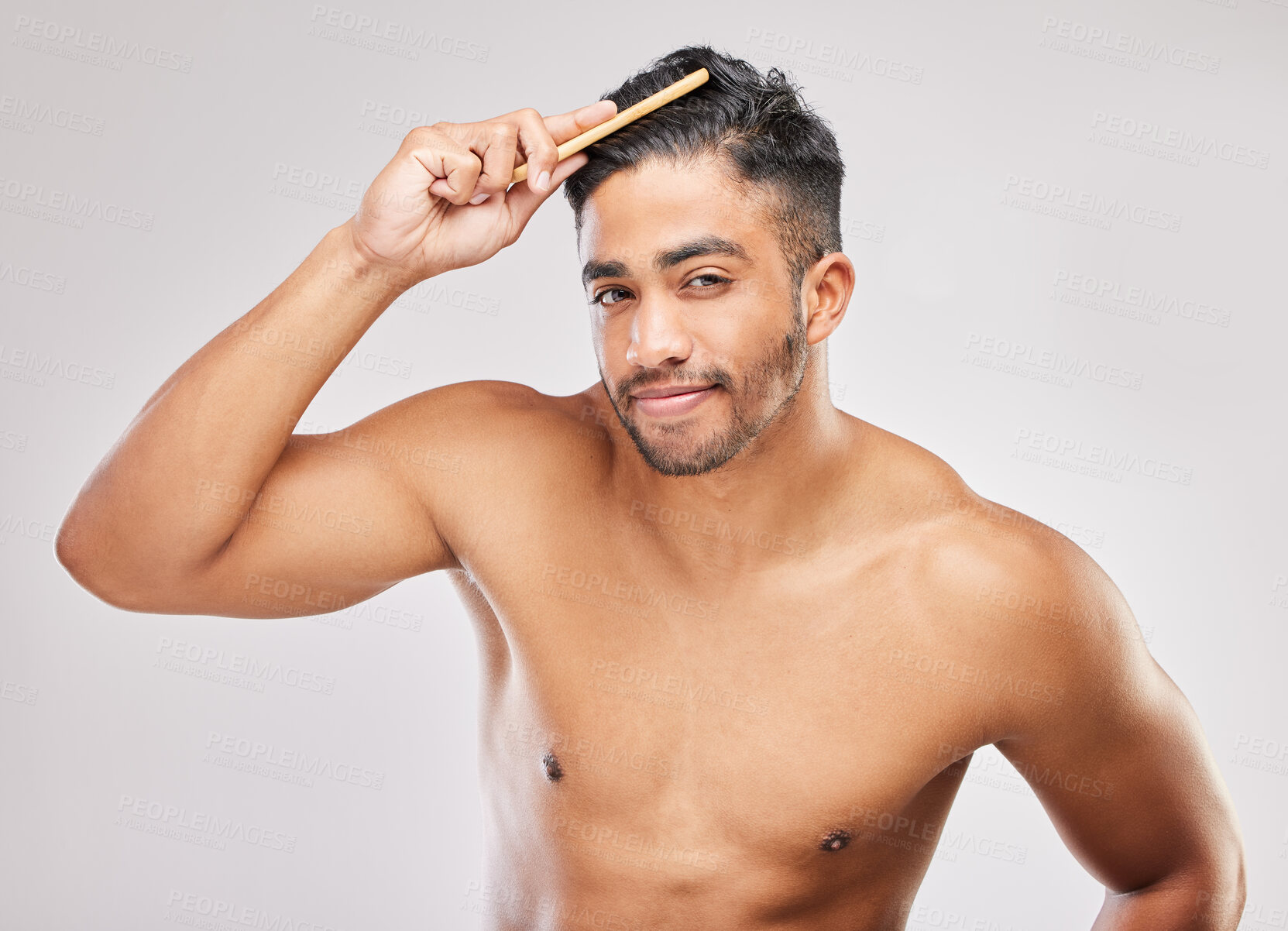 Buy stock photo Portrait, brushing hair and man with comb, grooming routine and wellness on white studio background. Face, person and model with luxury, hygiene and beauty with confidence, cosmetic tool or aesthetic