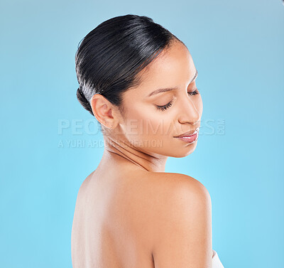 Buy stock photo Woman, eyes closed an skincare for routine in studio on blue background and satisfied with results. Natural, beauty and glow with self care for transformation, luxury and skin treatment in cosmetics