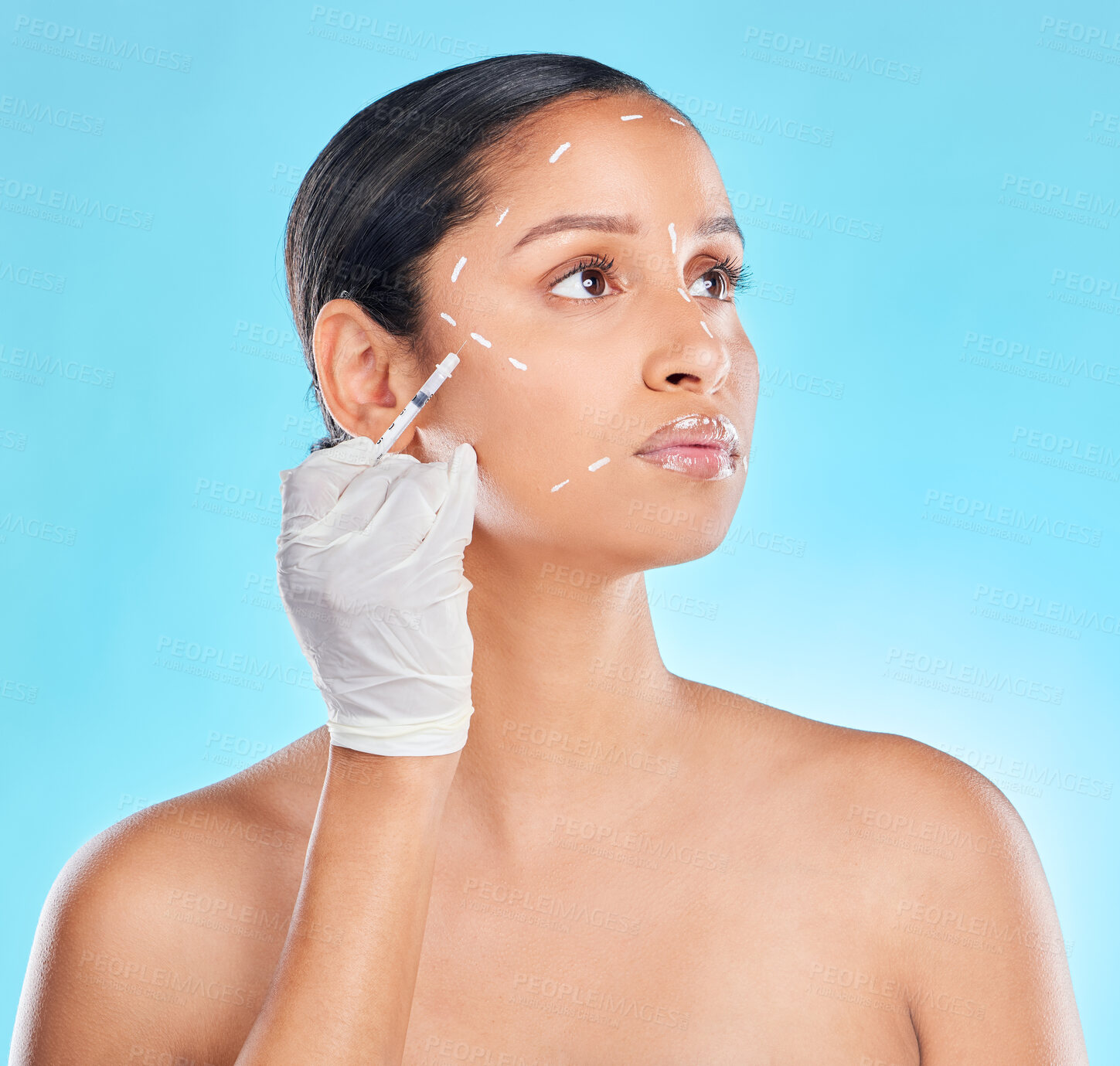 Buy stock photo Plastic surgery, needle and woman in studio with hand, lines and plastic surgery on blue background. Beauty, cosmetic or medical treatment for face and selfcare, filler or skincare or wellness for female model