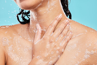 Buy stock photo Cleaning, shower and hand with soap for skincare, hygiene or wellness isolated on blue background. Water splash, person and model bath closeup with foam for dermatology, health and washing for beauty