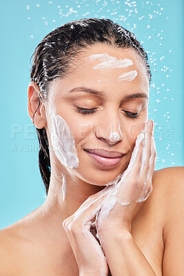 Buy stock photo Beauty, shower and woman with soap in studio for skincare, hygiene or wellness isolated on blue background. Water, foam bath and model cleaning with eyes closed for dermatology, health and wash face