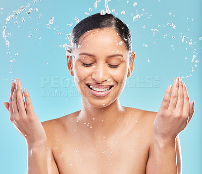 Buy stock photo Shot of a young woman posing against a blue background