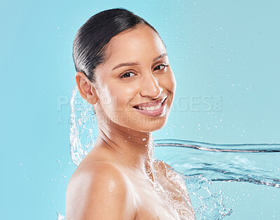 Buy stock photo Shot of a young woman posing against a blue background