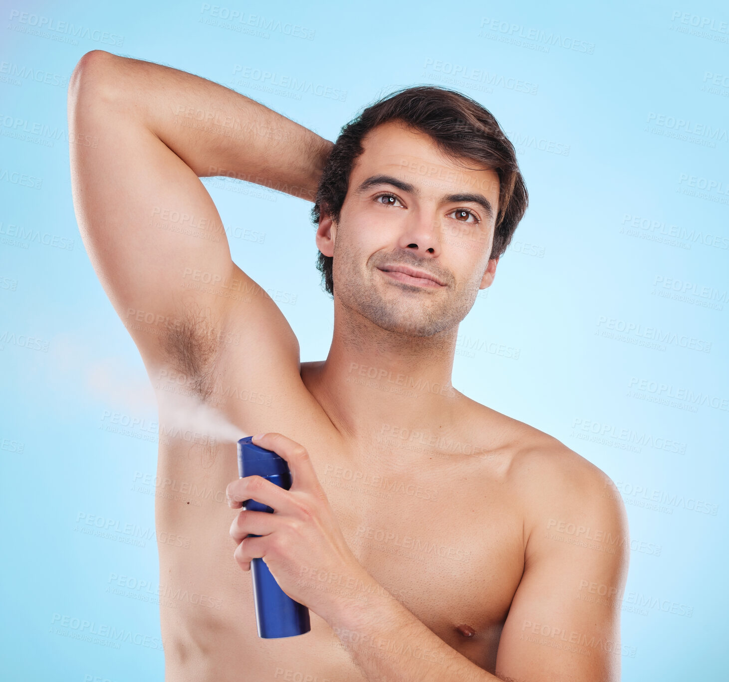 Buy stock photo Grooming, man and deodorant in morning, routine and wellness in body care, hygiene and blue background. Male person, cosmetics and fresh for confidence, masculine and fragrance with product in studio